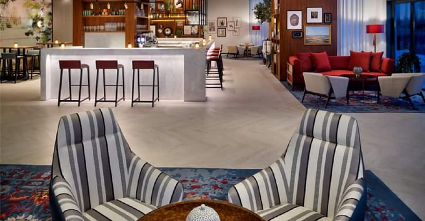 Junipers lounge at Vida Emirates Hills: chic hotel space for business networking and meetings.