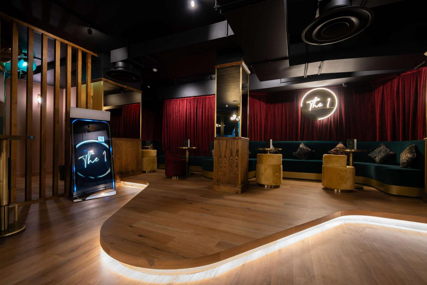 Semi-private hire area in The 1 Bar, featuring plush seating for corporate events and gatherings. - Banner