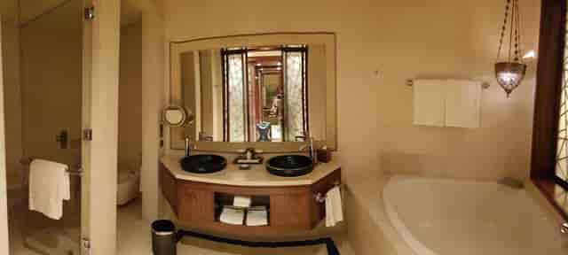 Luxury bathroom at Raffles Dubai with double vanities, perfect for VIP stays and hotel events.