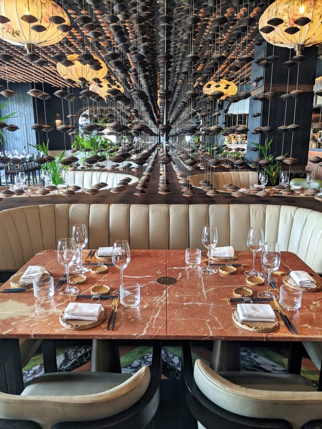 Clay Restaurant semi-private dining area with plush banquettes for VIP dinners and networking.