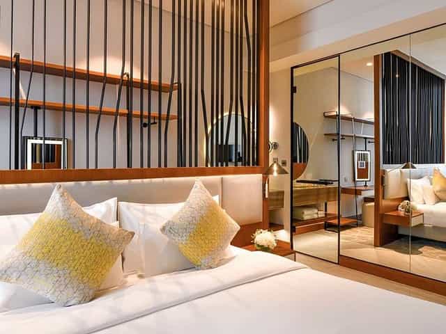 Luxury hotel room at Huzza Grand Mercure Dubai for VIP business travel and speaker accommodation.