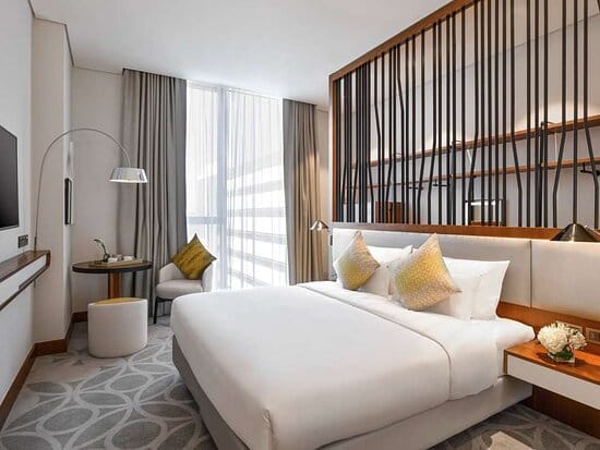 Modern hotel room at Qova Café, Grand Mercure Dubai City, perfect for executive travel and meetings.