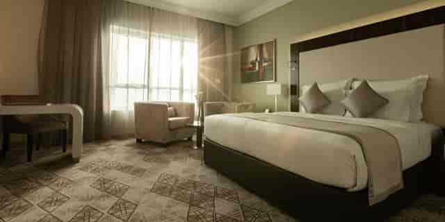 Luxury guest room at Elite Byblos Hotel, perfect for VIP accommodations and conference blocks.