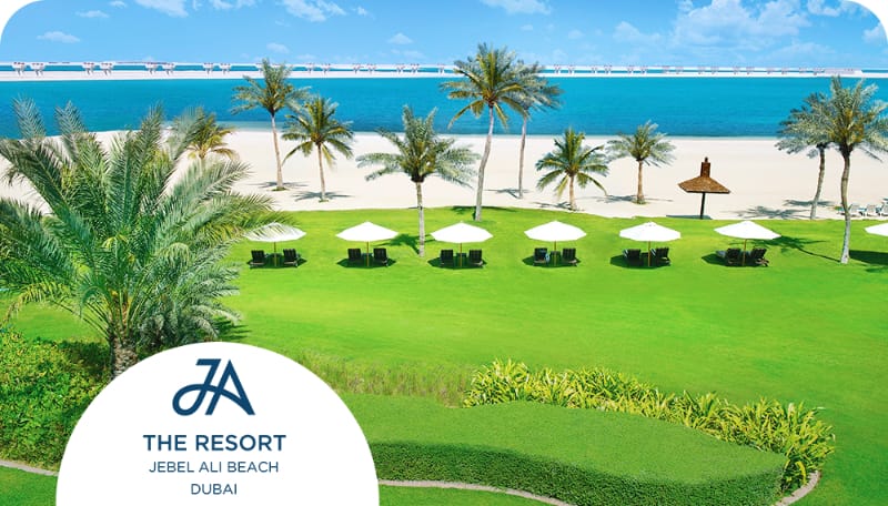 Beachfront lawn at JA Beach Hotel for outdoor corporate incentive event and small-group breakout.