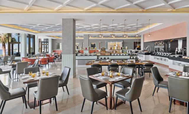 Contemporary hotel restaurant dining area for business networking and corporate breakfast events.