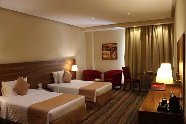 Al Khaleej Palace Deira Hotel twin meeting room with seating area for corporate conferences.