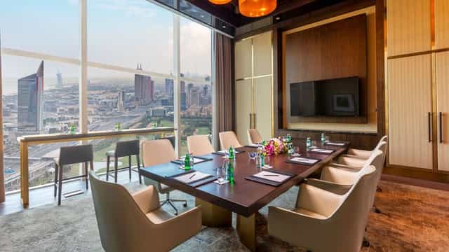 Boardroom at Taj Jumeirah Lakes Towers with skyline view for executive meetings and VIP events.