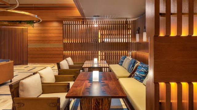 Raia Rooftop bar with natural wood decor for upscale networking events and corporate breakouts.