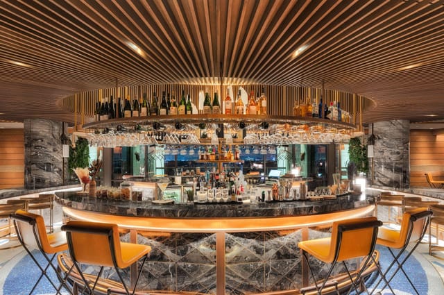 Circular bar at Raia Rooftop Lounge, ideal for upscale cocktail receptions and VIP networking.