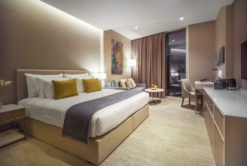 JA Lake View Hotel executive room with dedicated workspace for business meetings and conferences.