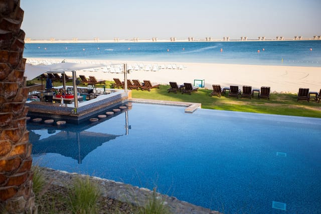 JA Palm Tree Court poolside venue for luxury executive retreats and incentive trips.