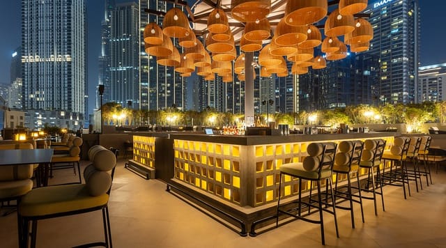 Upscale rooftop bar with skyline views for corporate cocktail receptions and VIP events.