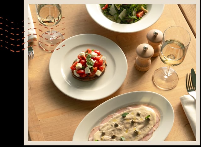Minimalist table setting at Lolli Restaurant, The Palm, for upscale networking or executive dinners.