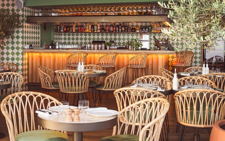Lolli Restaurant: upscale corporate reception venue with elegant seating for networking events.