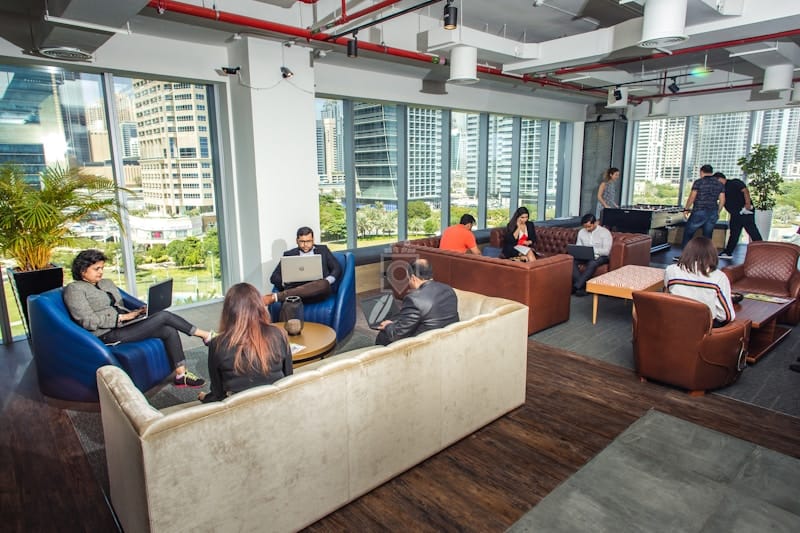 Meeting room with soft seating and city views for coworking and networking events.