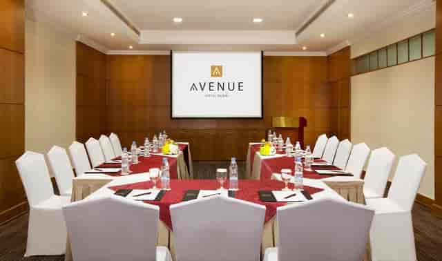U-shape boardroom at Avenue Hotel with wood paneling for corporate meetings and business conferences.