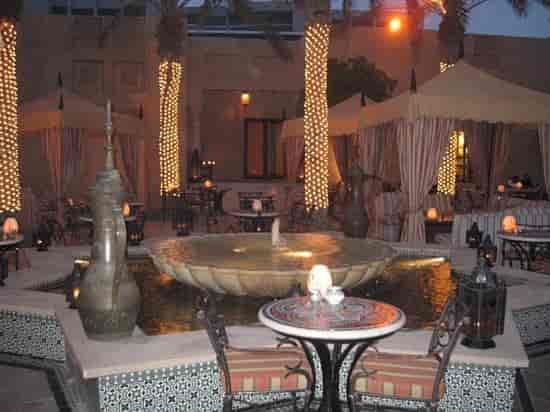 Shisha courtyard at The Red Lion, warm ambient lighting for evening receptions and networking events.