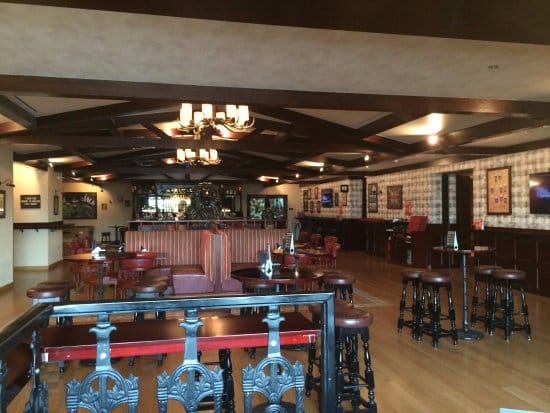Red Lion pub lounge with high-top booths, ideal for networking events and corporate mixers.