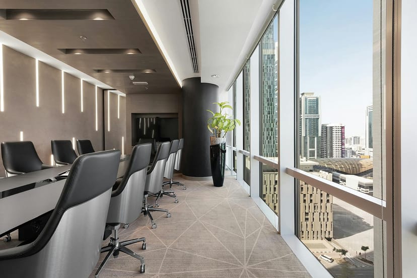 Executive boardroom with floor-to-ceiling windows for corporate meetings and client pitches.