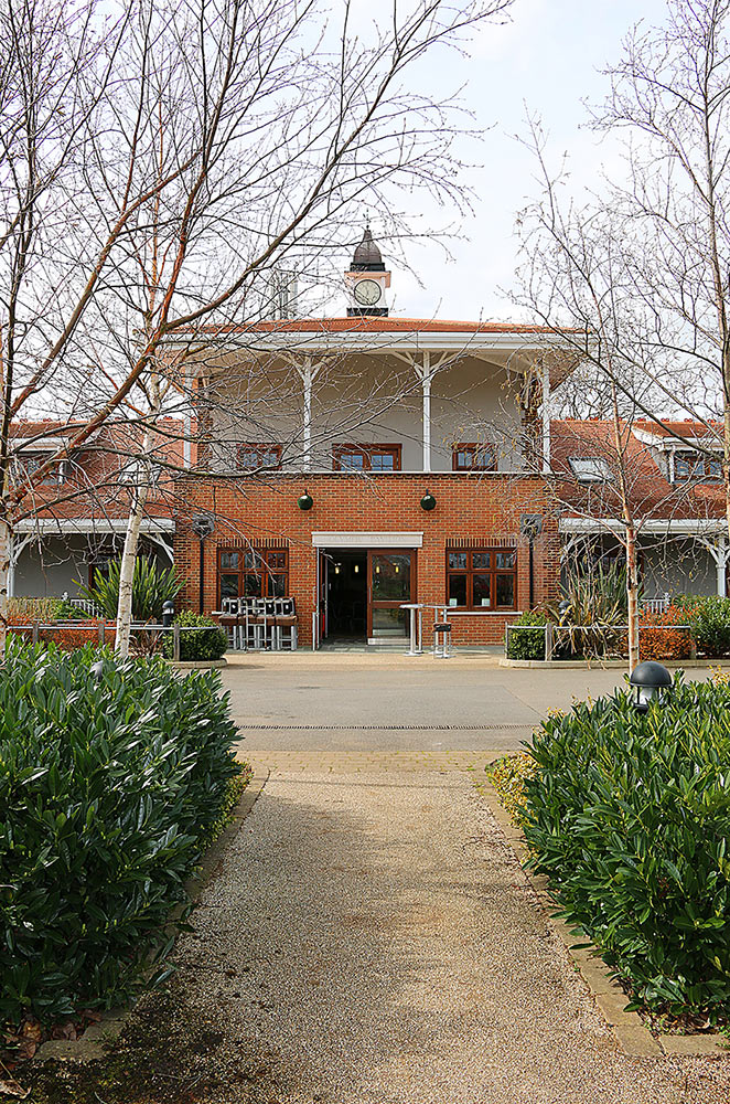 Olympic Pavilion at Trailfinders Sports Club, ideal for events with charming brickwork and greenery. - Banner