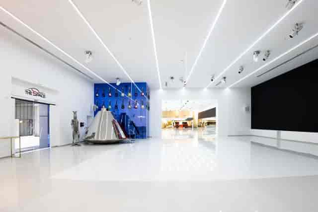 Modern event venue with digital display wall for product launches and corporate receptions.