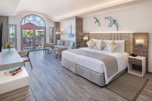 Luxury JA Palm Tree Court VIP suite with workspace for business travel and corporate events.
