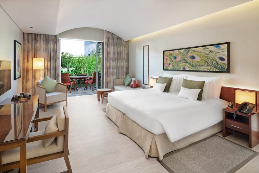 Refined suite at JA Palm Tree Court with private terrace for corporate incentive travel.