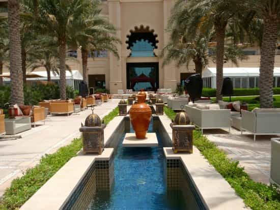 Fairmont The Palm Courtyard: Luxury outdoor networking space with water features for event hire.