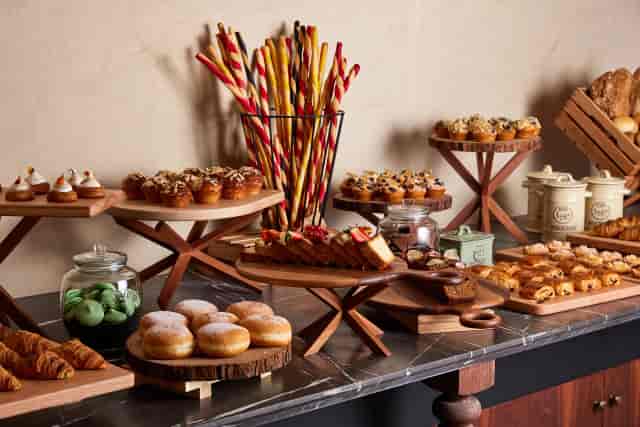 Breakfast buffet display with rustic wooden risers at InterContinental Ras Al Khaimah resort.