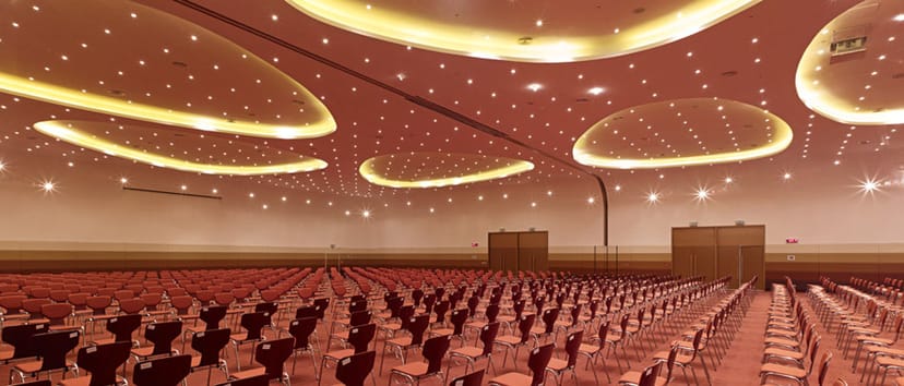 Zayed University theater-style ballroom with cove lighting for conferences and events.