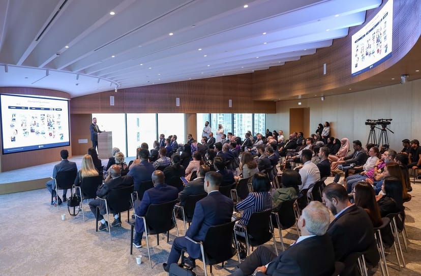 Dubai Chambers theater-style seminar room with dual screens for corporate events and workshops.