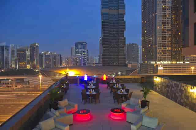 Rooftop venue with illuminated seating for networking events and upscale cocktail receptions.