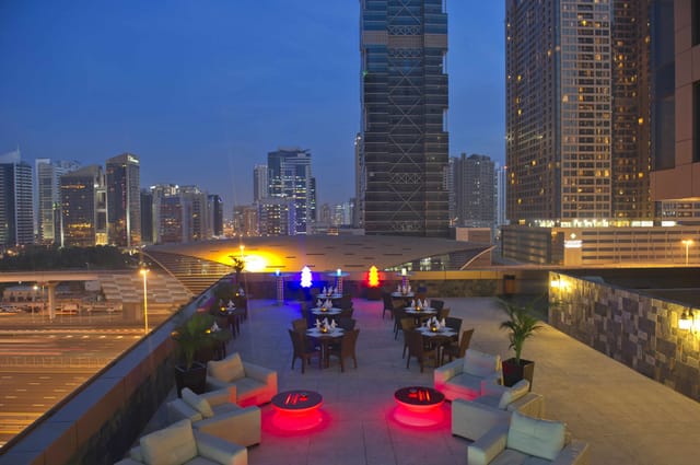 Rooftop venue with illuminated seating for networking events and upscale cocktail receptions.