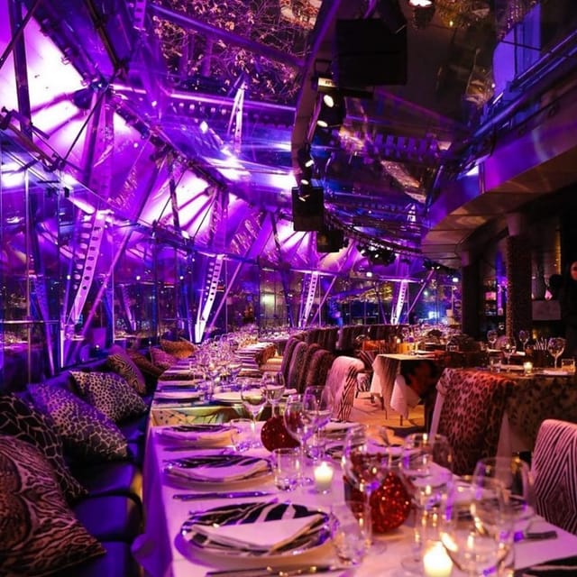 Lounge-style event at Justme Milano with purple lighting for corporate dinners and cocktail parties.
