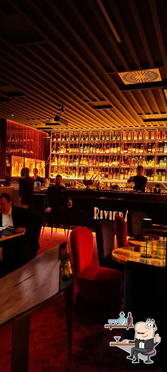 High-end lounge with illuminated backbar for corporate receptions and VIP networking events.