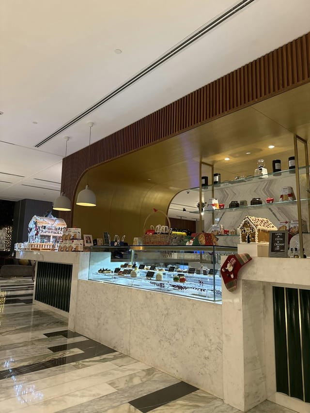 Al Fursan hotel lobby display for F&B events and luxury guest check-in activations.