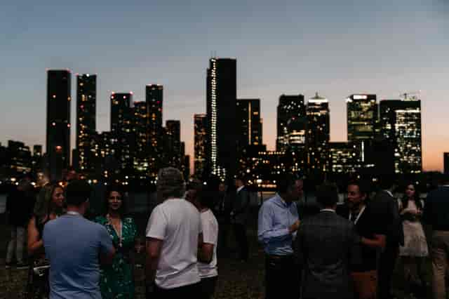 Corporate networking reception at Magazine London with sunset backdrop, ideal for business events.