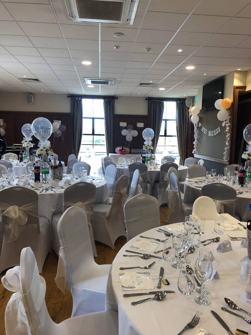 Elegant Emerald Room wedding reception with balloon centerpieces for upscale event venue hire.