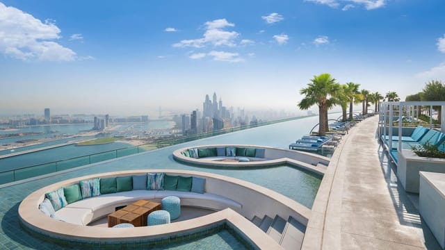 Rooftop library at Address Beach Resort with infinity pool and skyline views, perfect for events.