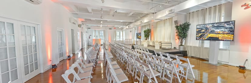 Midtown Loft and Terrace event space with white chairs for presentations and panel discussions.