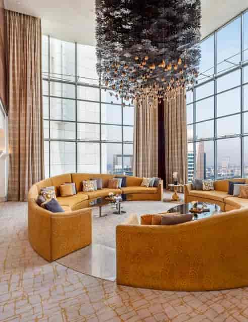 Royal Suite lounge in The H Dubai with plush seating and city views, perfect for events.