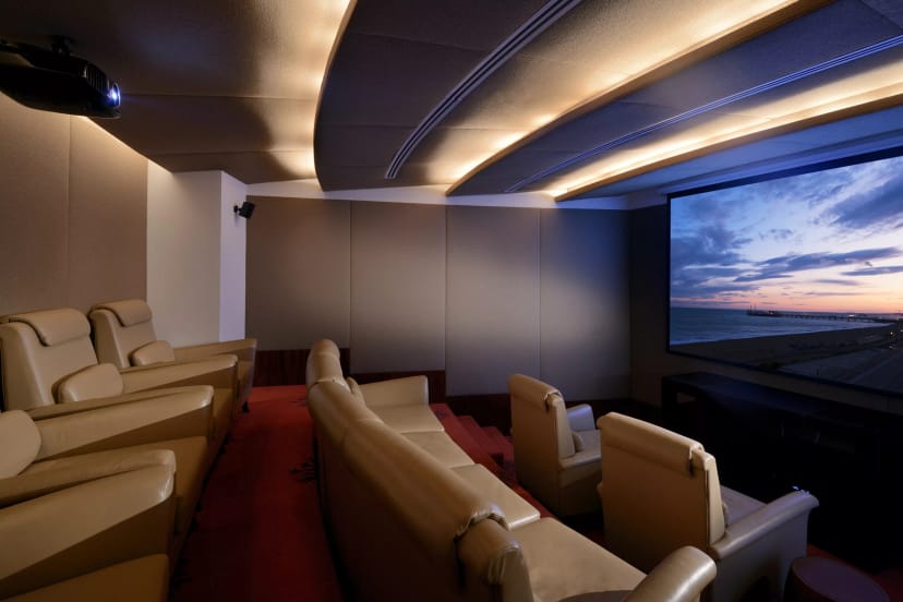 Royal Suite at The H Dubai with plush seating for film screenings and corporate events.