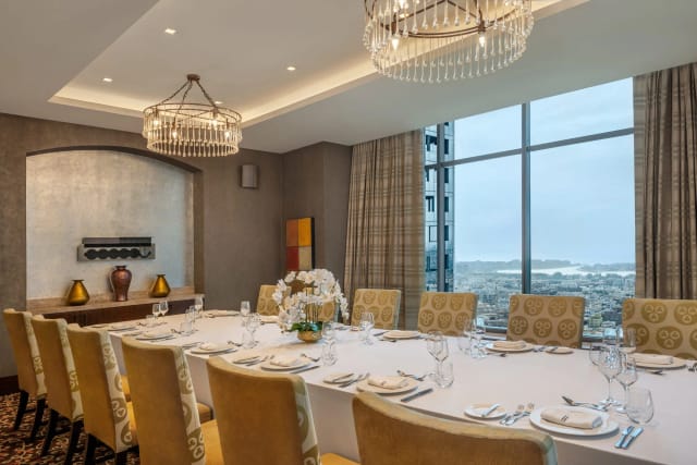 Elegant meeting room in The H Dubai's Royal Suite for corporate events and gatherings.