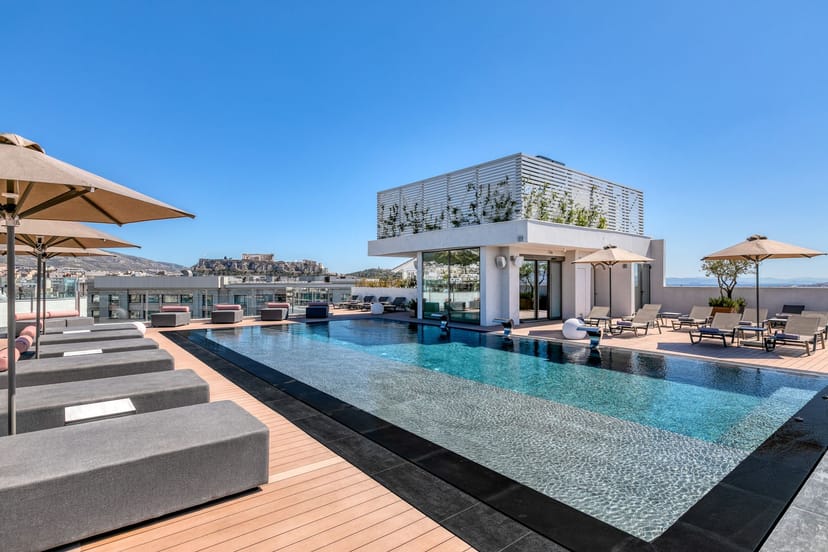 Vikos rooftop pool deck at Stanley Hotel with Acropolis view for luxury incentive travel events.
