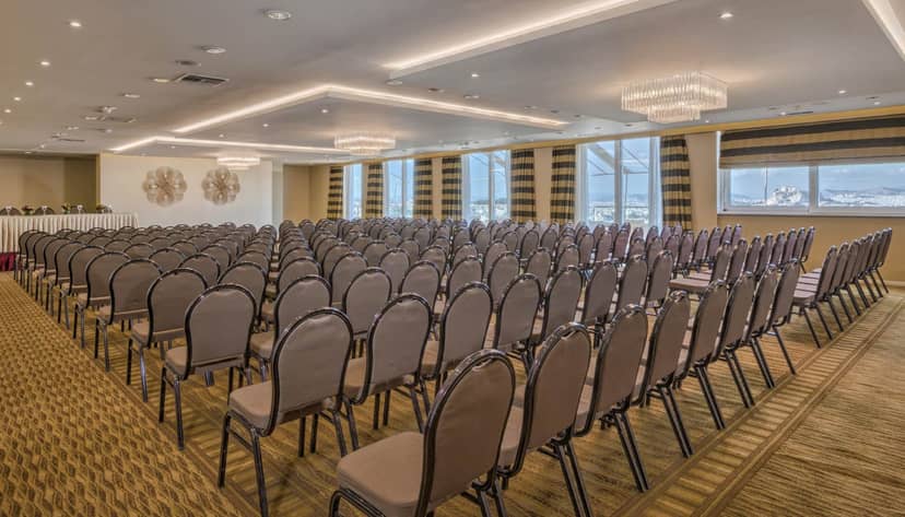 Ilissos meeting room theater setup for professional corporate conferences and plenary sessions.
