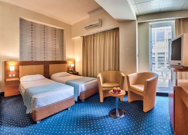Twin guest room at Athens Cypria Hotel for conference accommodation and budget business travel.