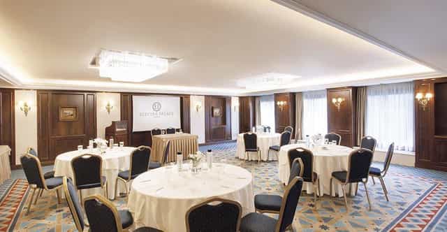 Wood-paneled cabaret-style conference room for corporate workshops and board meetings in Athens.