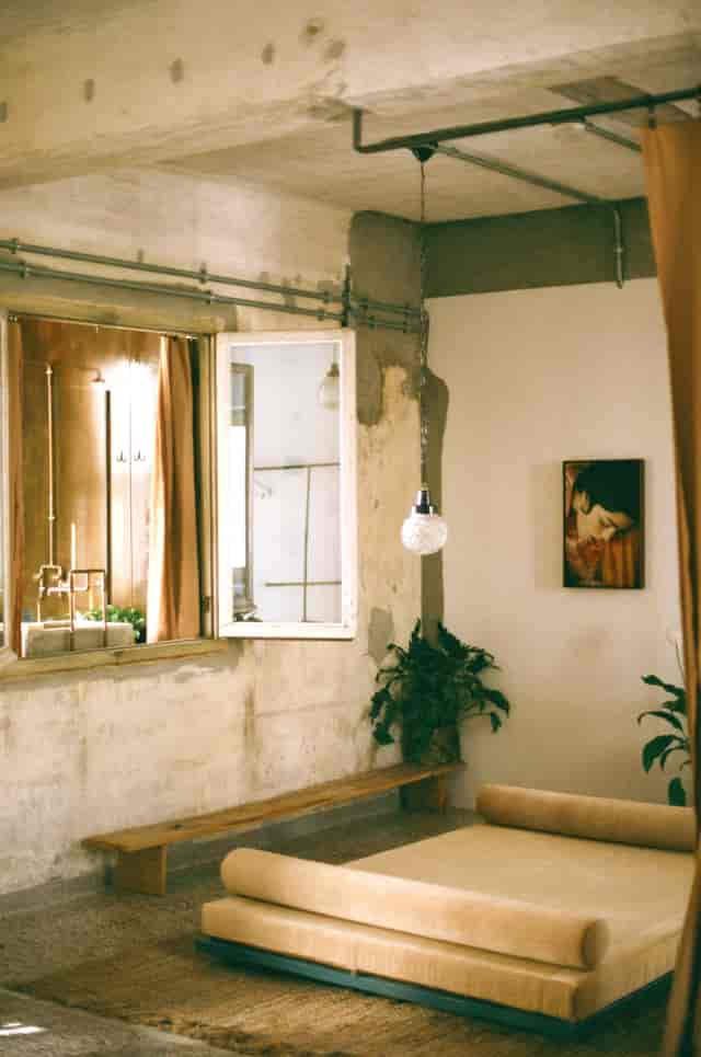 Industrial-chic boutique event space in Mona Athens with atmospheric lighting for VIP hospitality.