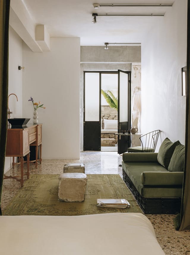 Minimalist VIP green room at Mona Athens for luxury site inspections and client consultations.