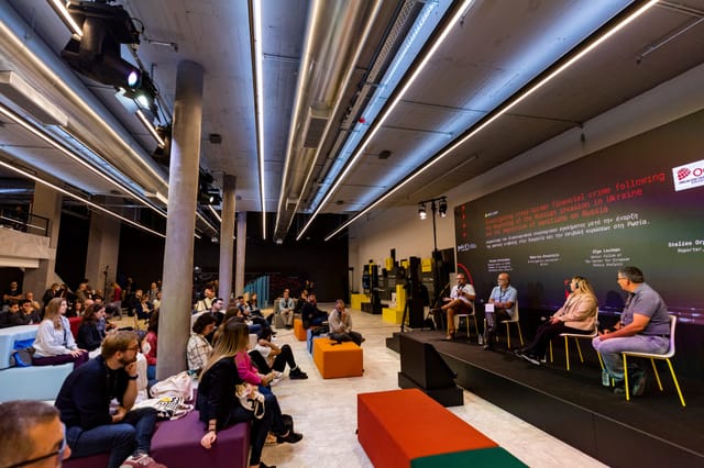 Arts Lounge at Athens Conservatoire: colorful modular seating for panel discussion event.